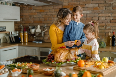 mother and children preparing Thanksgiving meal