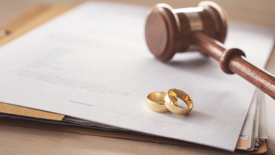 wedding rings, divorce papers, and a gavel